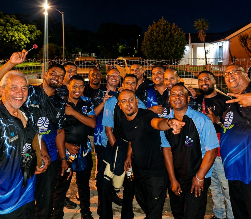 Parklands Dart Club members in club shirts gathered together after an evening league match